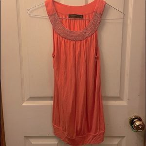 Orange tank with beading at neck